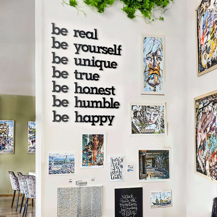Matte black modern industrial metal wall art reading ‘Be Yourself – Be Real – Be Unique – Be Honest – Be Humble – Be Happy’ — seven 2 mm thick steel quote pieces, easy no‑drill adhesive installation, customizable floating layout for indoor or outdoor décor