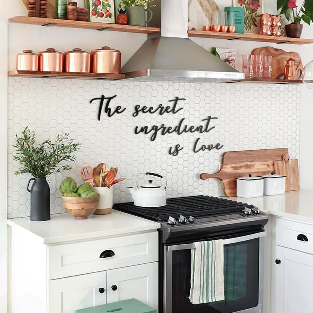 Matte black modern industrial metal wall art reading ‘The Secret Ingredient Is Love’—five 2 mm thick steel pieces, easy no‑drill adhesive installation, customizable layout for kitchen or outdoor décor