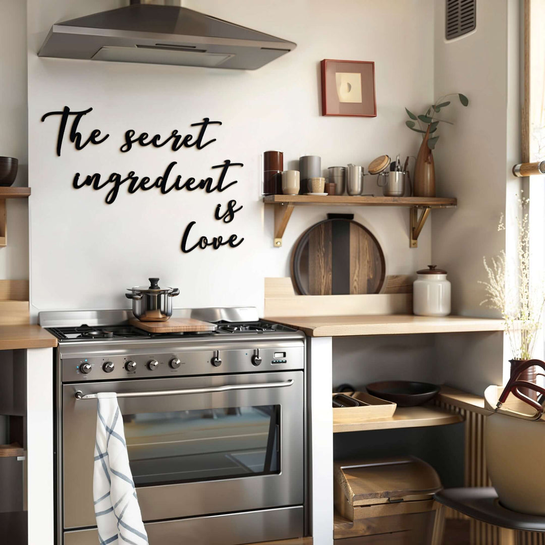 Matte black modern industrial metal wall art reading ‘The Secret Ingredient Is Love’—five 2 mm thick steel pieces, easy no‑drill adhesive installation, customizable layout for kitchen or outdoor décor
