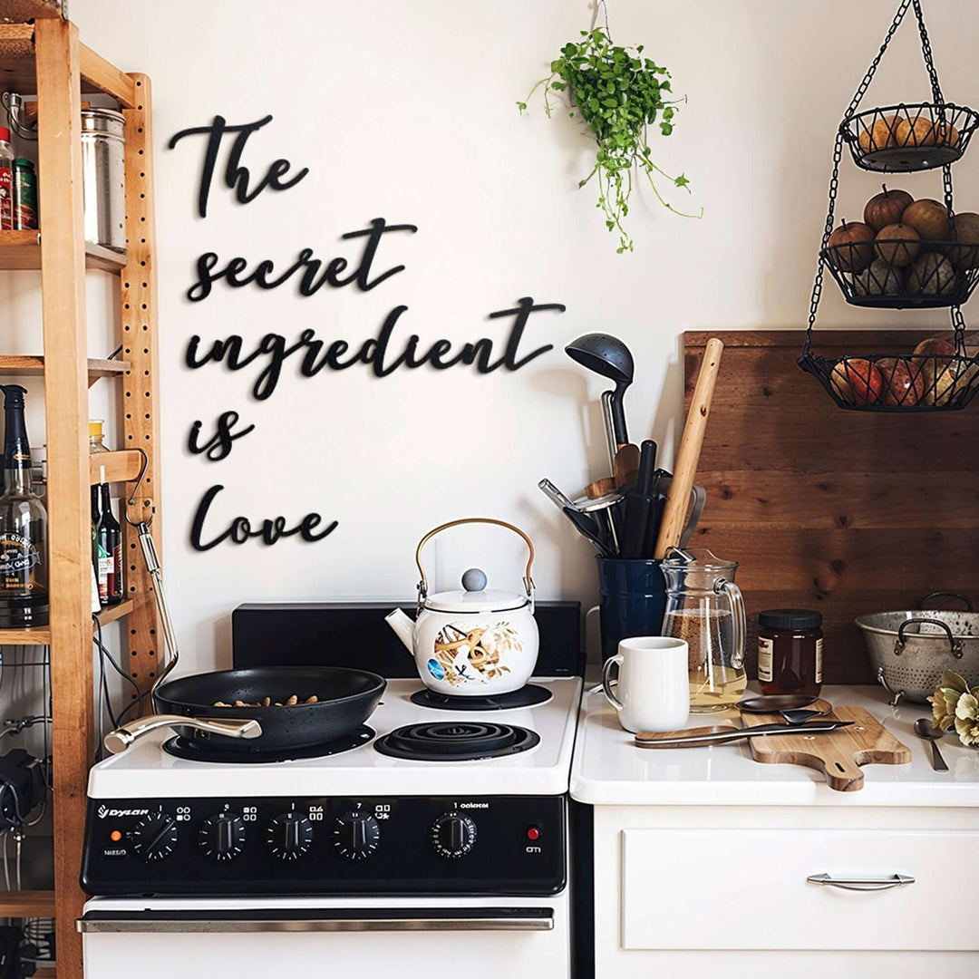 Matte black modern industrial metal wall art reading ‘The Secret Ingredient Is Love’—five 2 mm thick steel pieces, easy no‑drill adhesive installation, customizable layout for kitchen or outdoor décor