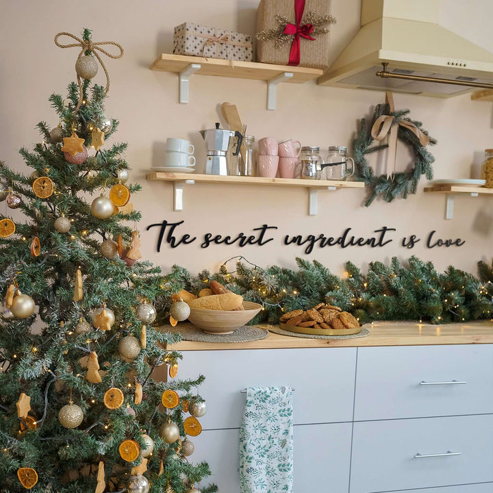 Matte black modern industrial metal wall art reading ‘The Secret Ingredient Is Love’—five 2 mm thick steel pieces, easy no‑drill adhesive installation, customizable layout for kitchen or outdoor décor