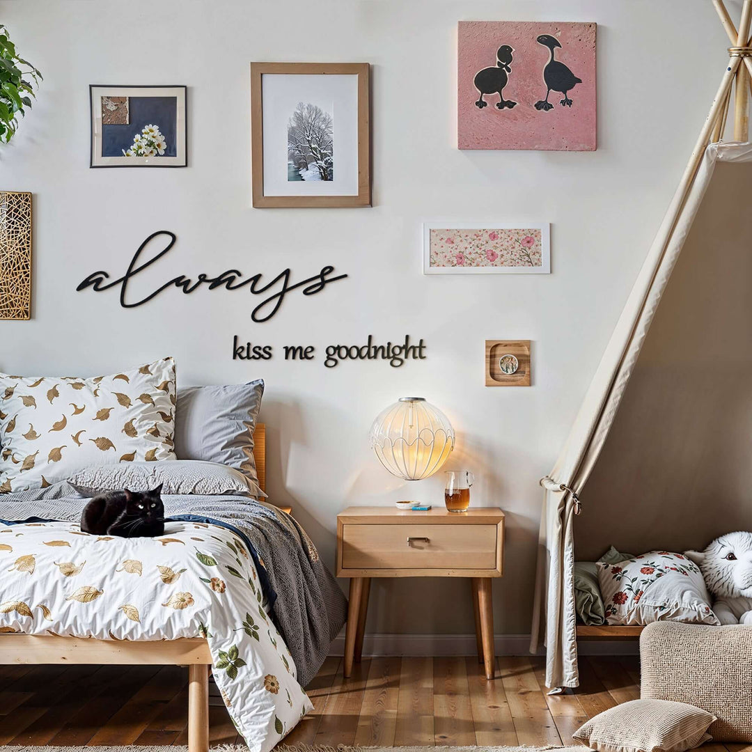 Matte black modern industrial metal wall art reading ‘Always Kiss Me Goodnight’ — four 2 mm thick steel pieces with easy no‑drill adhesive strips, customizable layout for romantic bedroom or indoor/outdoor décor